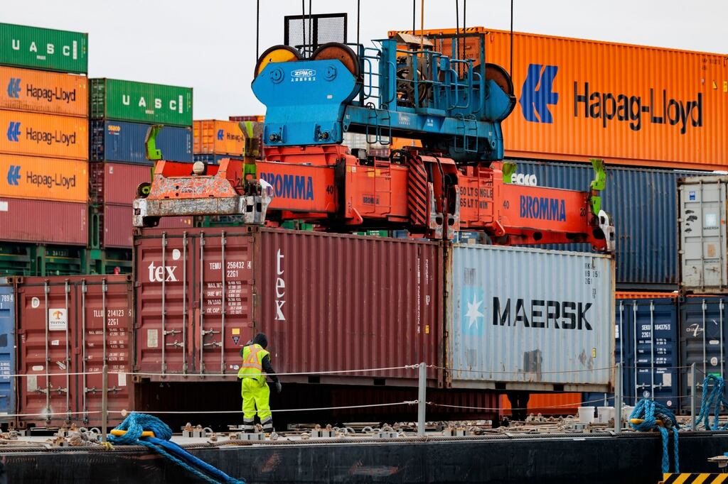 A worker helped load containers onto the Columbia Elizabeth barge at the Port of Philadelphia in Pennsylvania on March 5.