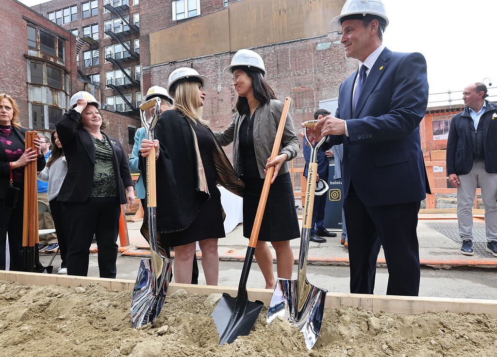 At the ceremonial groundbreaking for the Holocaust Museum Boston, Boston Mayor Michelle Wu, center, spoke with Jody Kipnis (left), and Todd Ruderman (right), cofounders of the Holocaust Legacy Foundation and Holocaust Museum Boston.