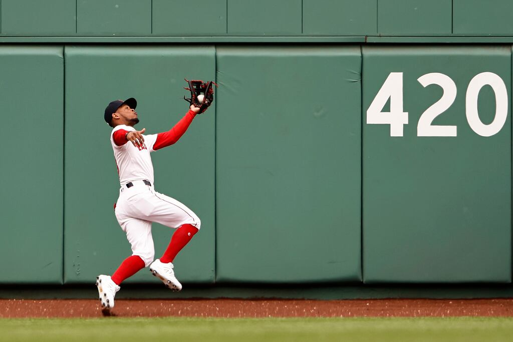 Ceddanne Rafaela makes a diving catch on a ball hit by the Orioles' Ramón Urías during the second inning.