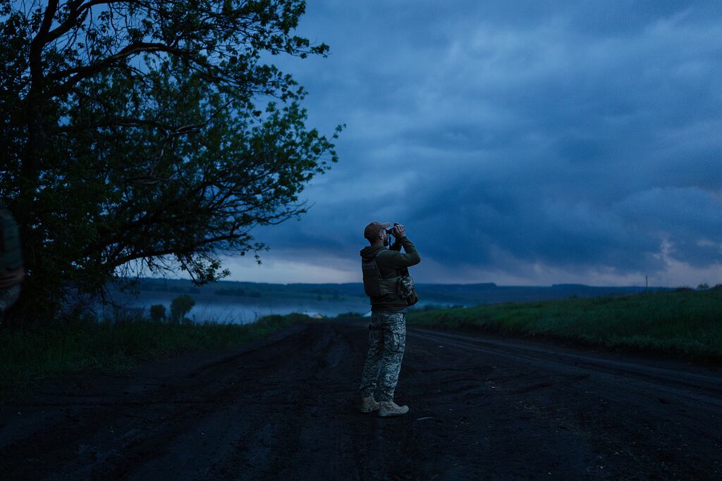 A soldier with Ukraine's 42nd Separate Mechanized Brigade at an air defense position, monitoring for Russian drones, in the Kharkiv region of Ukraine on May 19.