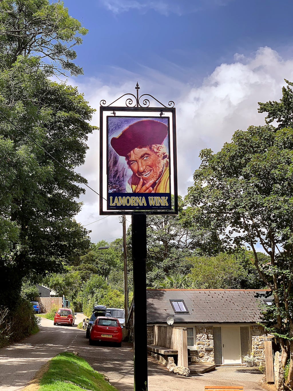 The Lamorna Wink’s pub sign depicting British actor Robert Newton, the writer’s father-in-law, as Long John Silver in 