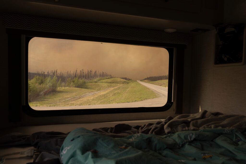 Wildfire smoke hung in the air above Highway 97 north of Buckinghorse River, British Columbia, on Friday.
