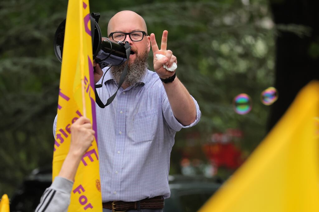 Jesse Martin, the executive vice president of SEIU 1199 NE, yelled into a microphone to the crowd.