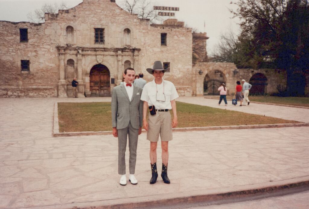 A frame of Tim Burton and Paul Reubens as Pee-wee Herman while filming “Pee-wee’s Big Adventure