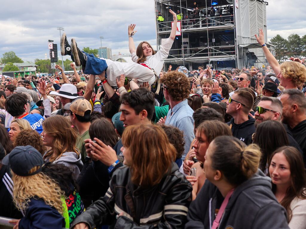 A fan crowd surfs while Sublime performed at Boston Calling on Sunday.