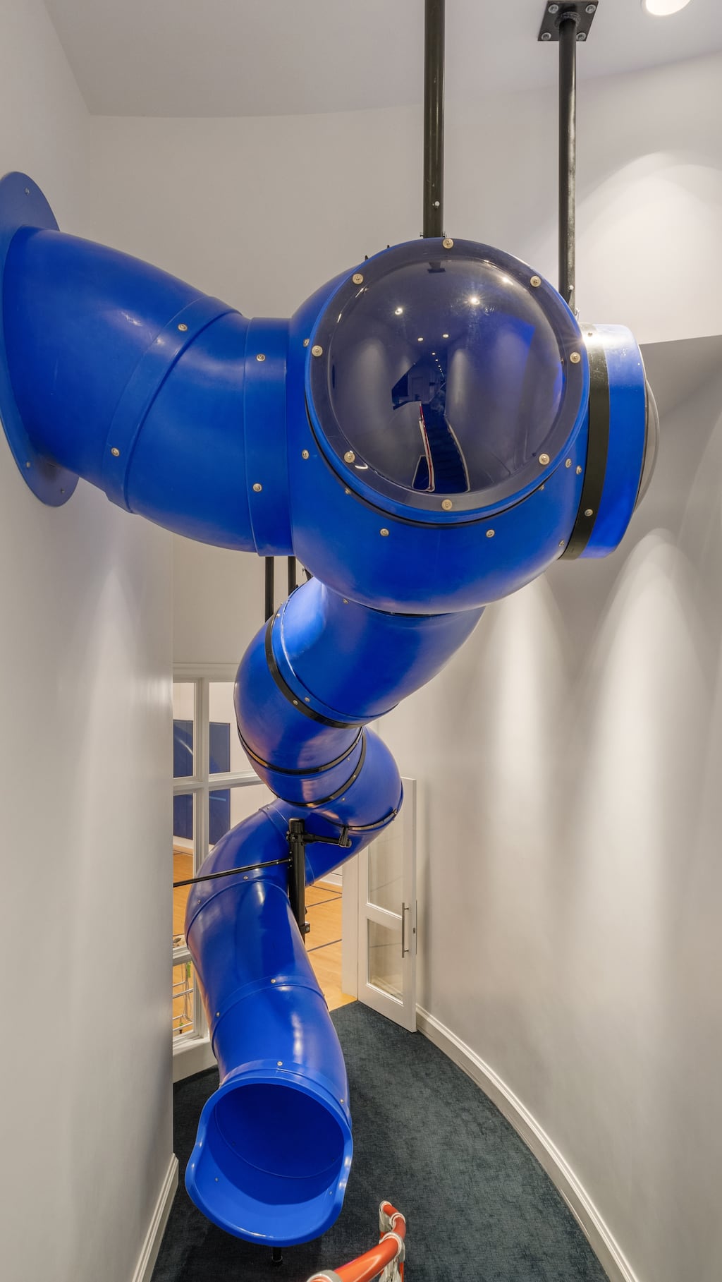 The indoor slide connects the game room to the indoor basketball court.