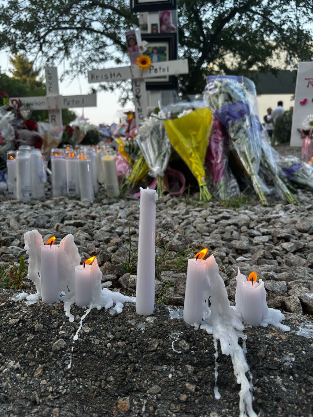 Hundreds of candles surrounded a memorial for Minaben and Krisha Patel, who died following a car crash last month.