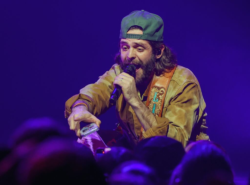 Thomas Rhett takes a fan's cellphone to take a selfie as he performed on the first night of his four-show run at BleauLive Theater at Fontainebleau Las Vegas on Dec. 6, 2024.