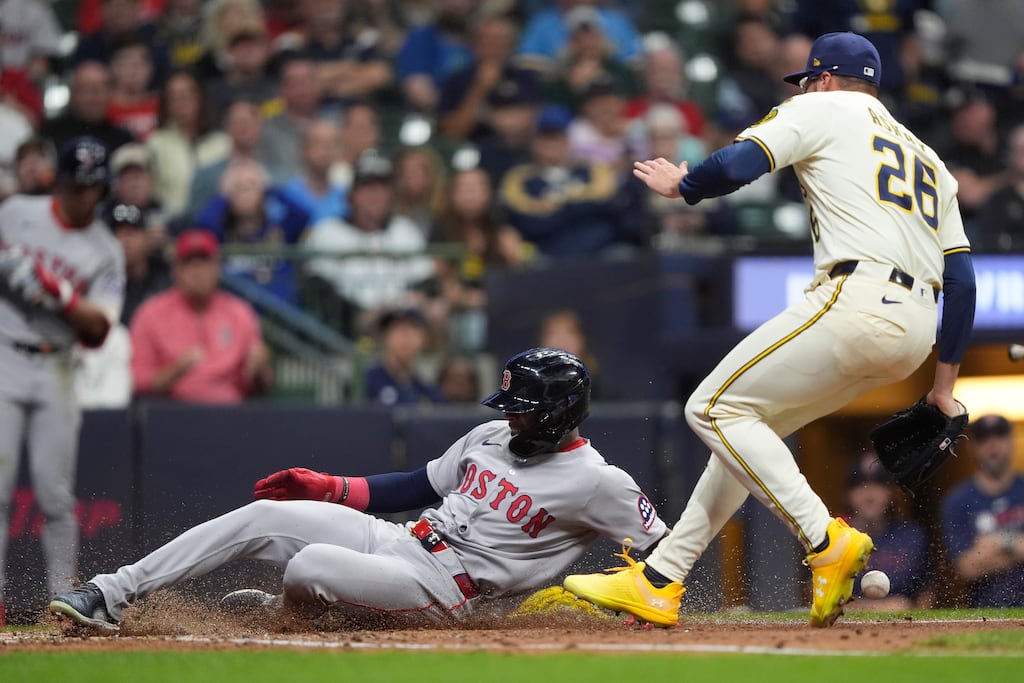 Ceddanne Rafaela slides in safely to score the Red Sox' lone run of the game on a wild pitch in the sixth inning.
