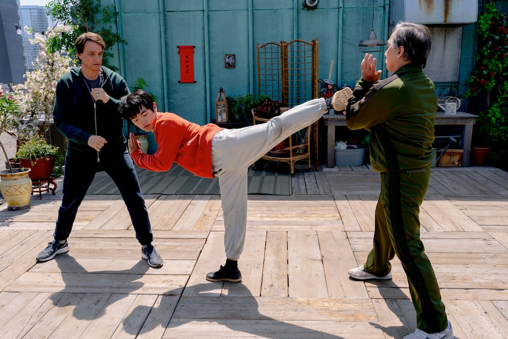 From left: Ralph Macchio, Ben Wang, and Jackie Chan.