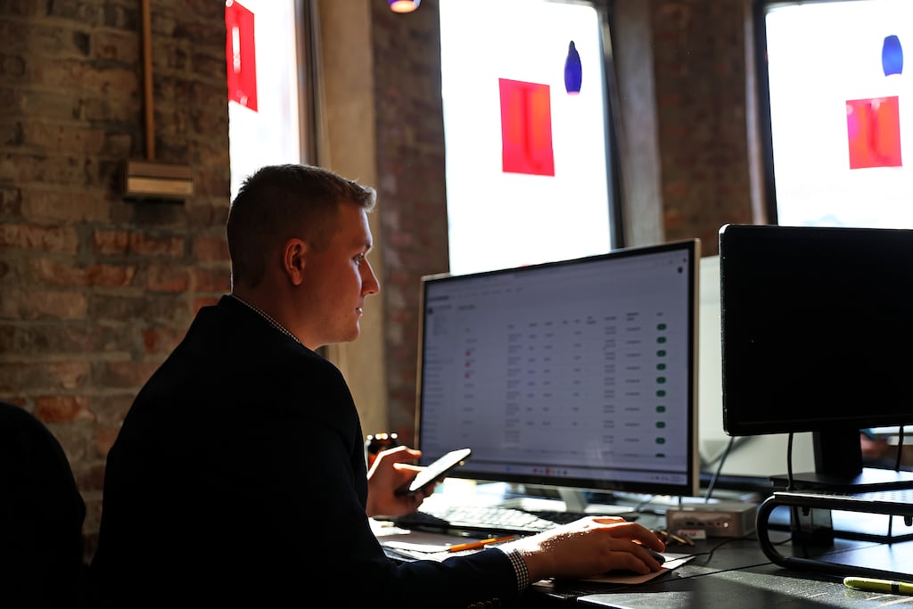 Thomas Macdonald sat at his desk in the Jacob Realty office on Newbury Street.