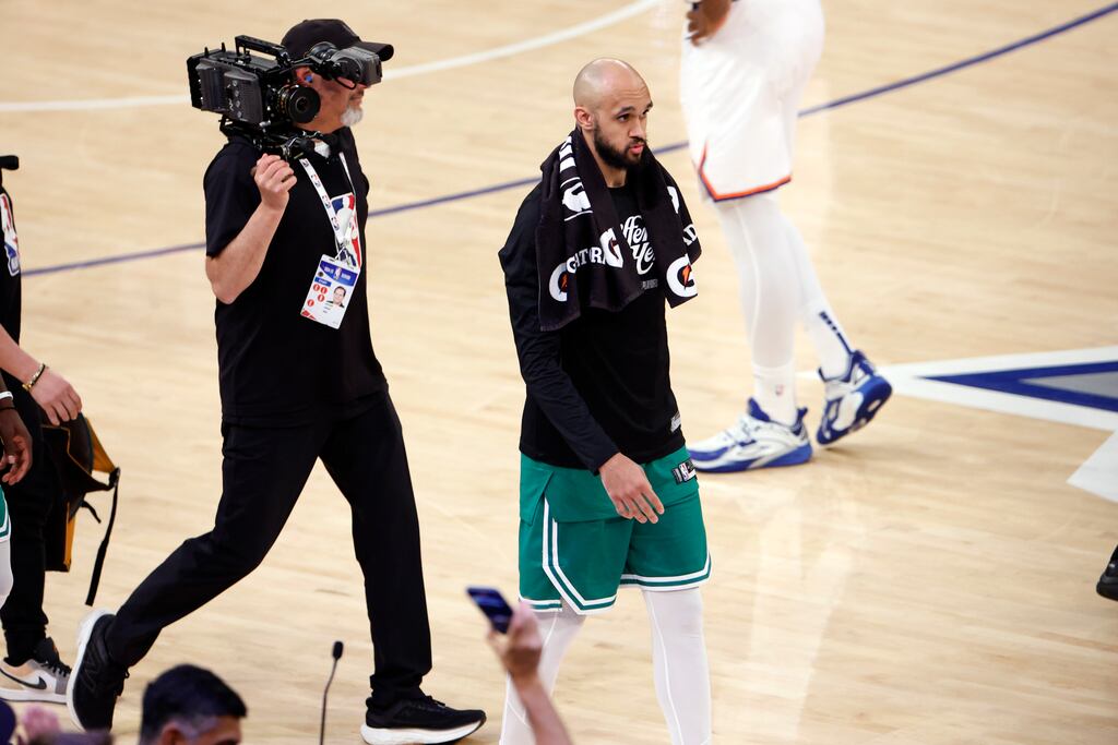 Derrick White leaves the court after the Celtics' loss to the Knicks Friday night in Game 6. The team faces an uncertain future with Jayson Tatum's injury and salary cap problems.