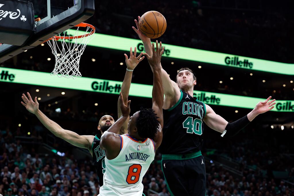 Celtics center Luke Kornet (right) blocks a shot by the Knicks' OG Anunoby in the third quarter Wednesday night, one of seven Kornet had in the game.
