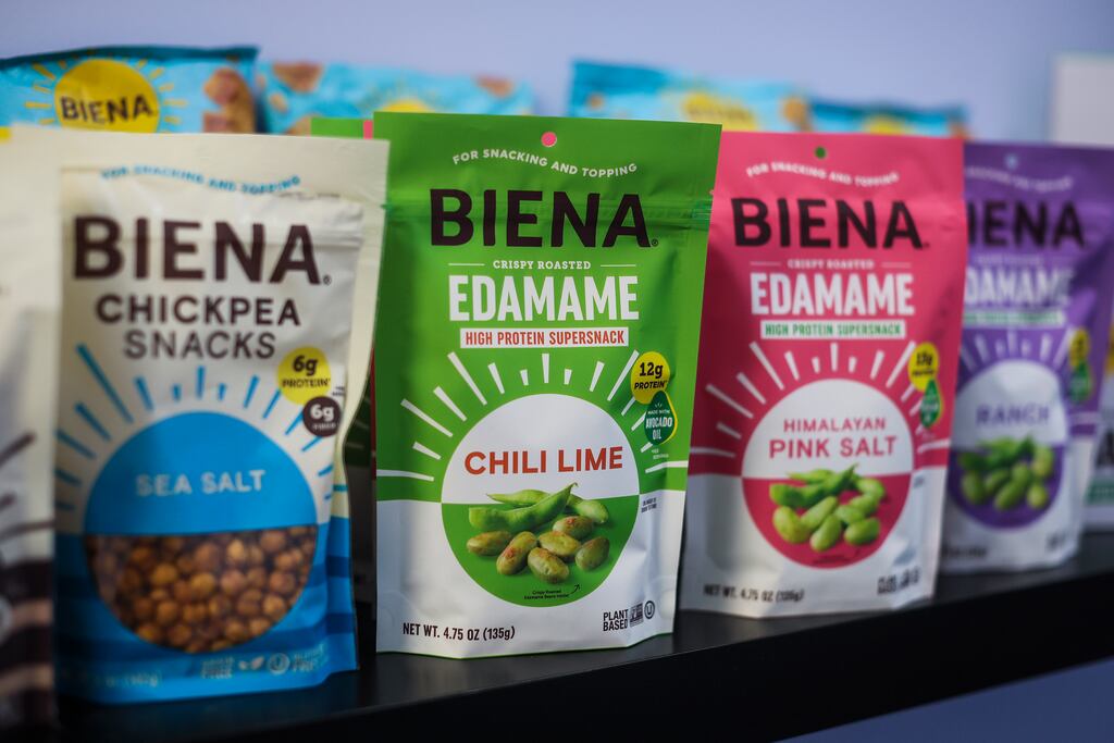 Biena Snacks' product line includes its newest offering of crispy roasted edamame snacks alongside their established chickpea snacks. CEO Poorvi Patodia says the Needham company's edamame products will face pricing challenges due to recent tariffs on imports from China.